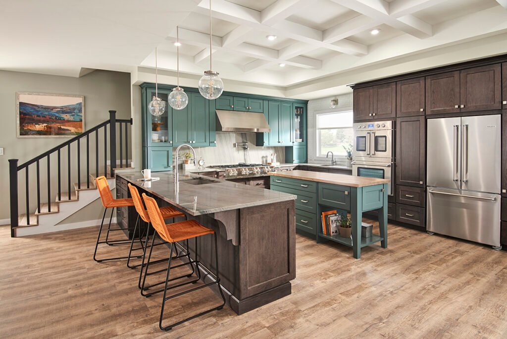 Kitchen with dark cabinetry and light wood-look vinyl floor