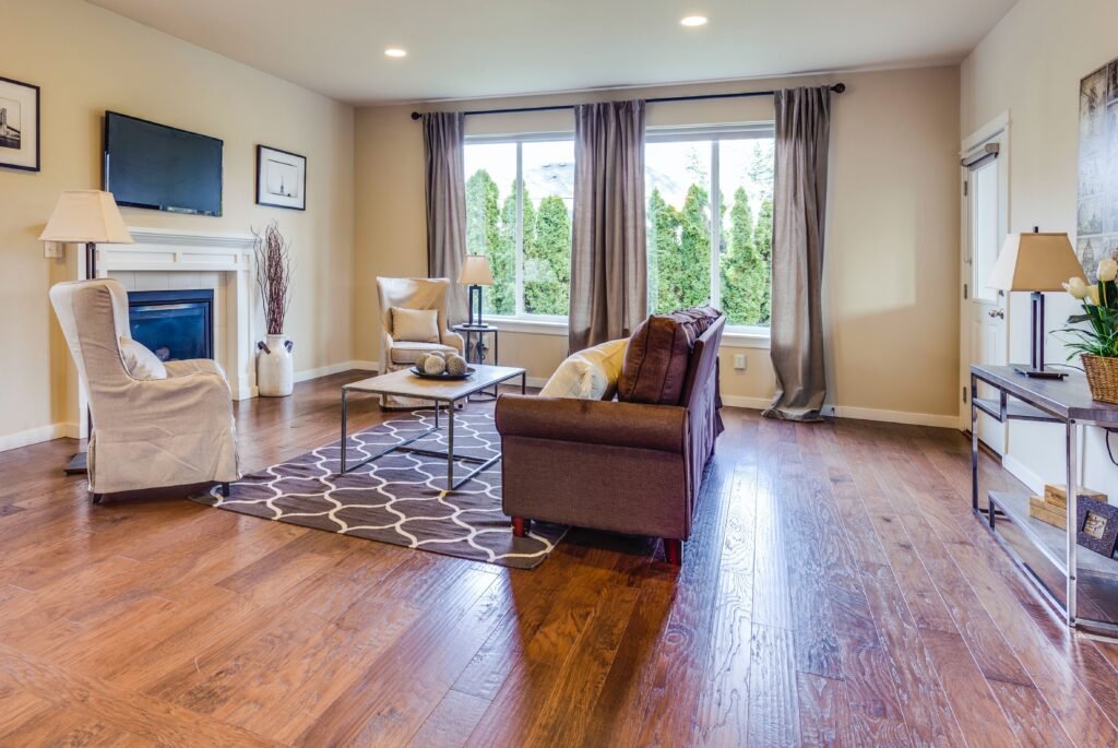 A minimal living room with hardwood installed floor