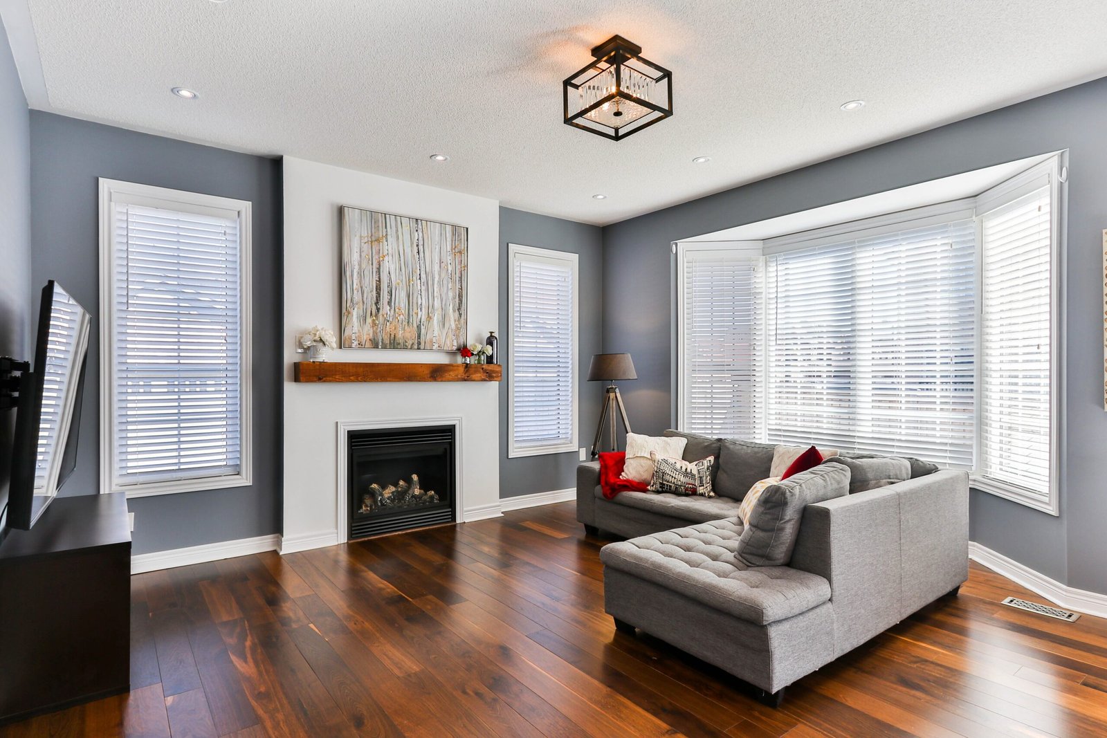 Contemporary living room with timeless hardwood flooring.